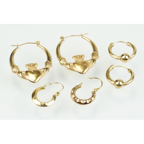 351 - 9ct gold hoop earrings to include a pair of Claddagh earrings, pair of ball hoops and two faceted ho... 