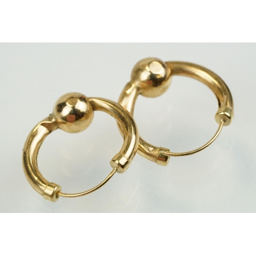 351 - 9ct gold hoop earrings to include a pair of Claddagh earrings, pair of ball hoops and two faceted ho... 