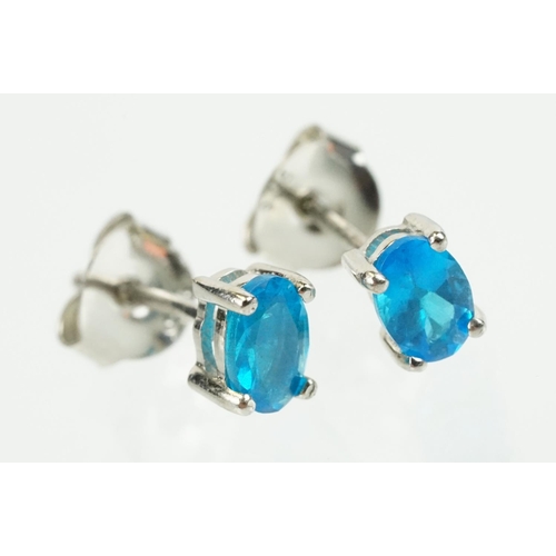 352 - Pair of silver and blue apatite gemstone stud earrings being set with a single oval cut stone to eac... 