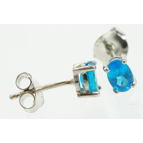 352 - Pair of silver and blue apatite gemstone stud earrings being set with a single oval cut stone to eac... 