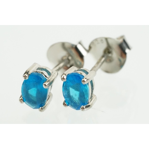 352 - Pair of silver and blue apatite gemstone stud earrings being set with a single oval cut stone to eac... 