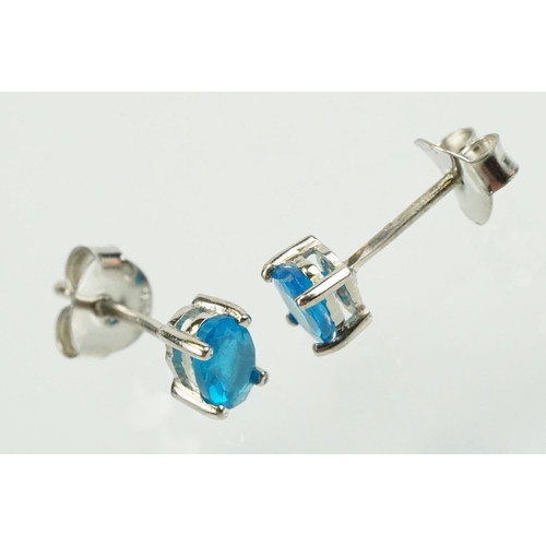 352 - Pair of silver and blue apatite gemstone stud earrings being set with a single oval cut stone to eac... 