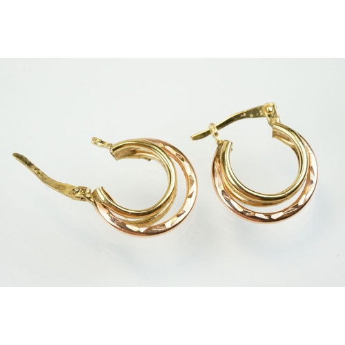 353 - Four pairs of 9ct gold hoop earrings to include two twist design hoops, a pair of triple hoop earrin... 