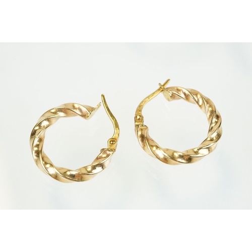 353 - Four pairs of 9ct gold hoop earrings to include two twist design hoops, a pair of triple hoop earrin... 