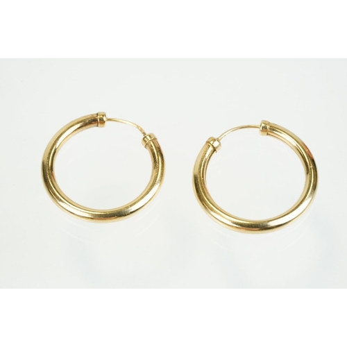 353 - Four pairs of 9ct gold hoop earrings to include two twist design hoops, a pair of triple hoop earrin... 