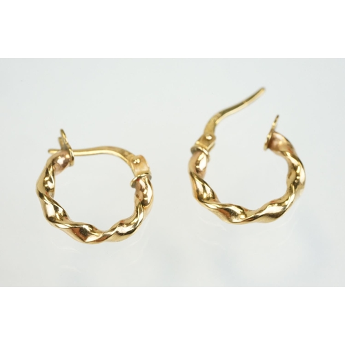 353 - Four pairs of 9ct gold hoop earrings to include two twist design hoops, a pair of triple hoop earrin... 