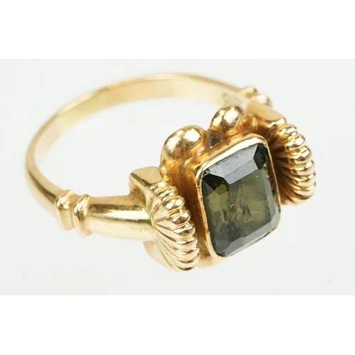 355 - Green tourmaline 18ct yellow gold ring, the rectangular mixed cut tourmaline measuring approx 8 x 6.... 