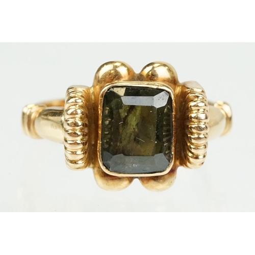 355 - Green tourmaline 18ct yellow gold ring, the rectangular mixed cut tourmaline measuring approx 8 x 6.... 