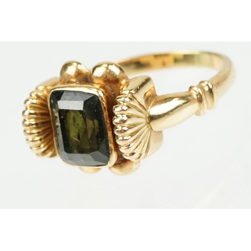 355 - Green tourmaline 18ct yellow gold ring, the rectangular mixed cut tourmaline measuring approx 8 x 6.... 