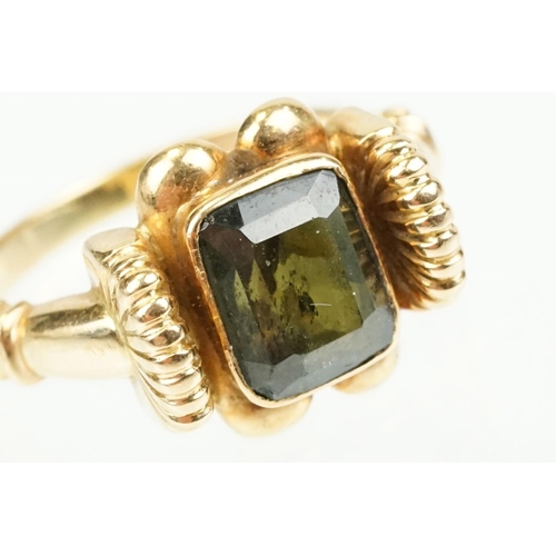 355 - Green tourmaline 18ct yellow gold ring, the rectangular mixed cut tourmaline measuring approx 8 x 6.... 