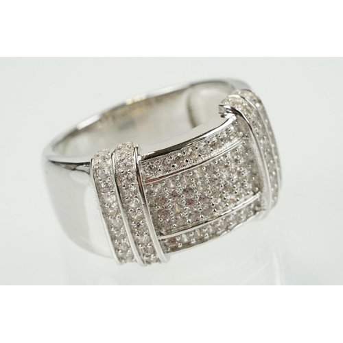 356 - Silver and cubic zirconia ring being pave set to the head with round cz stones. Marked 925. Size Q.