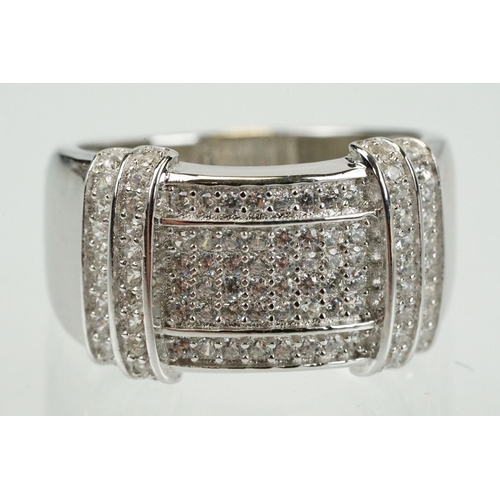 356 - Silver and cubic zirconia ring being pave set to the head with round cz stones. Marked 925. Size Q.