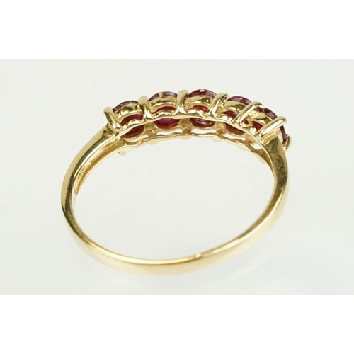 364 - Ruby 14ct yellow gold ring, five round mixed cut rubies, diameter approx 3.5mm, shared claw settings... 