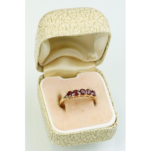 364 - Ruby 14ct yellow gold ring, five round mixed cut rubies, diameter approx 3.5mm, shared claw settings... 