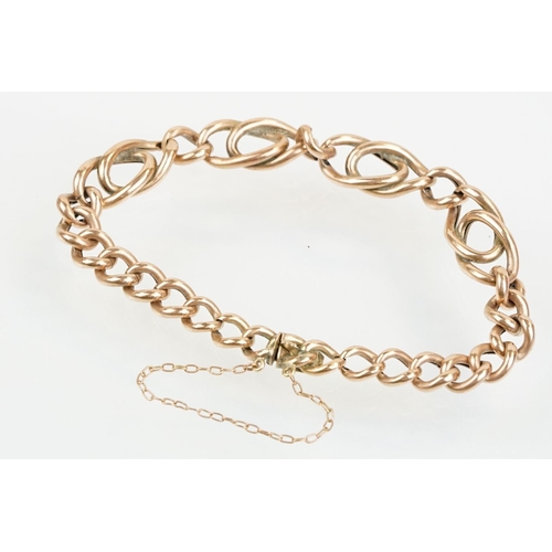 37 - Victorian 9ct rose gold bracelet having curb and fancy links with tongue in groove clasp. Marked 9ct... 