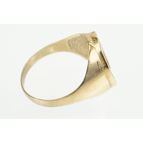 372 - 9ct gold horse shoe ring with moulded details. Hallmarked present but rubbed. Size S.5.