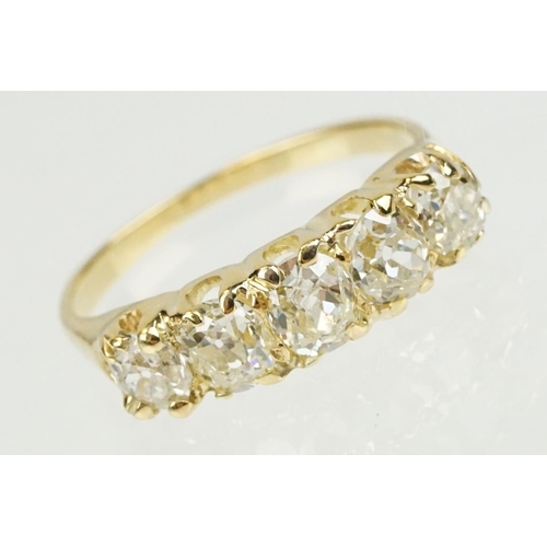 379 - Diamond unmarked yellow gold five stone ring, five graduated old cut diamonds, assessed clarities VS... 