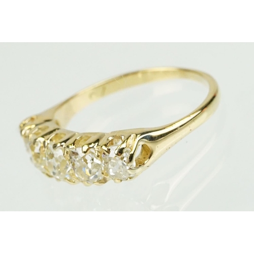 379 - Diamond unmarked yellow gold five stone ring, five graduated old cut diamonds, assessed clarities VS... 