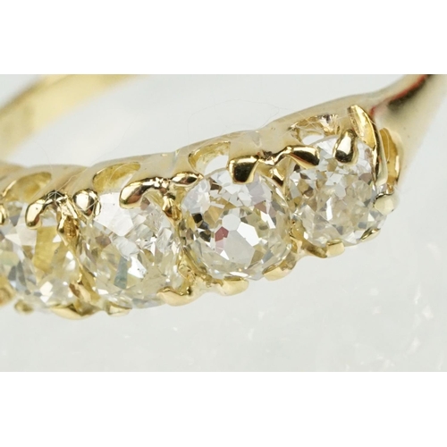 379 - Diamond unmarked yellow gold five stone ring, five graduated old cut diamonds, assessed clarities VS... 