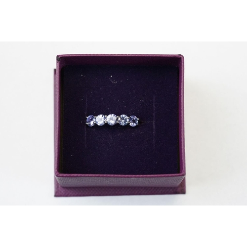 382 - Collection of thirteen silver and blue / purple gem stone set dress rings of assorted design. All ma... 