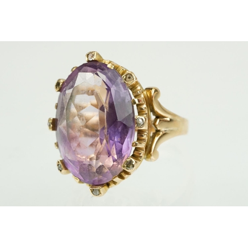 383 - Amethyst and diamond unmarked yellow gold ring, the large oval mixed cut amethyst measuring approx 2... 