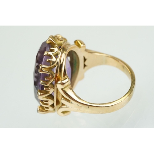 383 - Amethyst and diamond unmarked yellow gold ring, the large oval mixed cut amethyst measuring approx 2... 