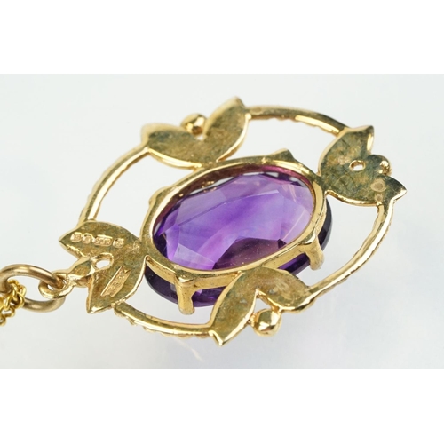 385 - 9ct gold and amethyst pendant necklace being set with an oval cut amethyst in a open work setting on... 