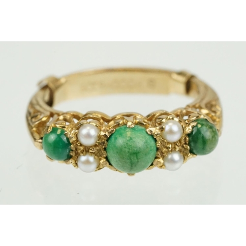 387 - 9ct gold turquoise and pearl ring being set with three green cabochons set with four pearls in betwe... 