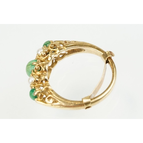 387 - 9ct gold turquoise and pearl ring being set with three green cabochons set with four pearls in betwe... 