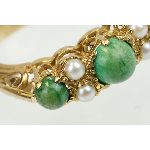 387 - 9ct gold turquoise and pearl ring being set with three green cabochons set with four pearls in betwe... 