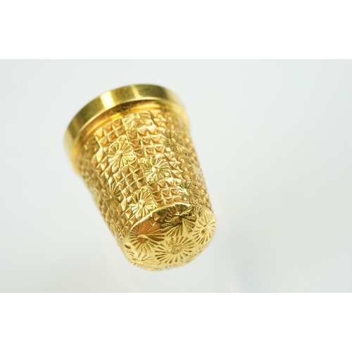 396 - 9ct gold hallmarked thimble with moulded details, size 15. Hallmarked Birmingham 1902, HG & S Ltd.