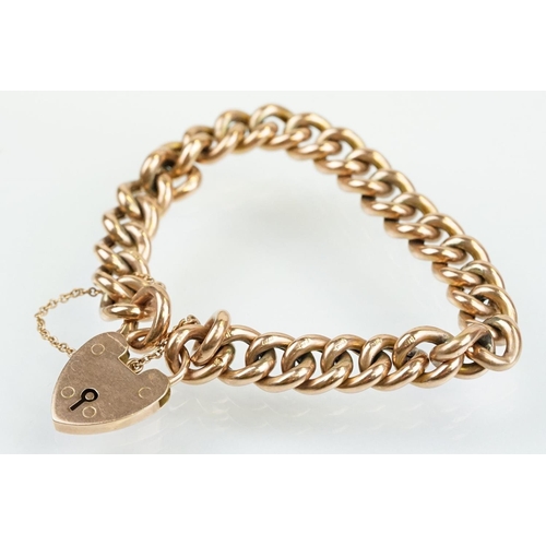 49 - Early 20th Century 9ct gold curb link bracelet having a heart padlock clasp. Lock marked 9ct gold, e... 