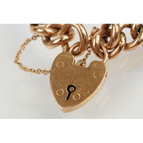 49 - Early 20th Century 9ct gold curb link bracelet having a heart padlock clasp. Lock marked 9ct gold, e... 