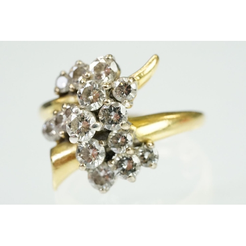 5 - Mid Century Vintage yellow gold and diamond crossover cluster ring being set with fifteen round bril... 