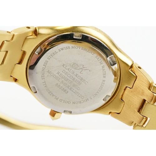 500 - Klaus-Koberc Decorum gold plated wrist watch having a tigers eye style dial, with diamonds set to th... 