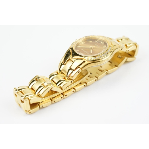 500 - Klaus-Koberc Decorum gold plated wrist watch having a tigers eye style dial, with diamonds set to th... 