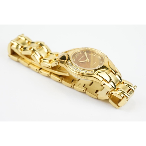 500 - Klaus-Koberc Decorum gold plated wrist watch having a tigers eye style dial, with diamonds set to th... 