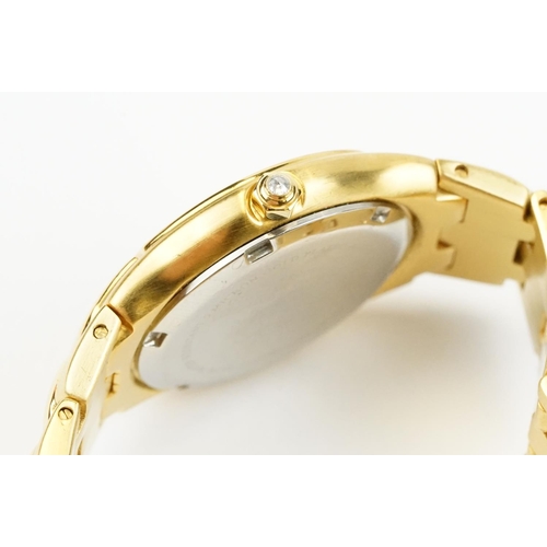 500 - Klaus-Koberc Decorum gold plated wrist watch having a tigers eye style dial, with diamonds set to th... 