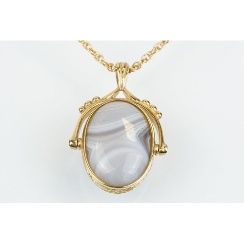 51 - 9ct gold swivel fob pendant necklace having an onyx and agate swivel fob pendant on a rope twist cha... 