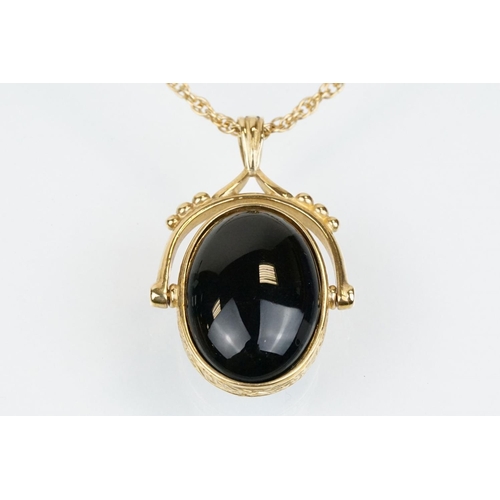 51 - 9ct gold swivel fob pendant necklace having an onyx and agate swivel fob pendant on a rope twist cha... 