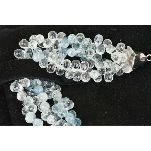 58 - Triple strand aquamarine beaded necklace, each thread with faceted aquamarine drops with forget me k... 