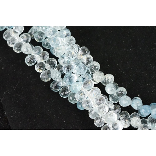 58 - Triple strand aquamarine beaded necklace, each thread with faceted aquamarine drops with forget me k... 