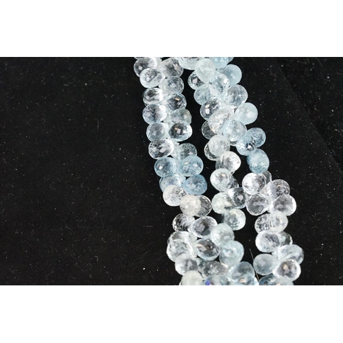 58 - Triple strand aquamarine beaded necklace, each thread with faceted aquamarine drops with forget me k... 