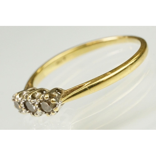 63 - 18ct yellow gold and diamond three stone ring. The ring being prong set with three round brilliant c... 