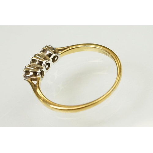 63 - 18ct yellow gold and diamond three stone ring. The ring being prong set with three round brilliant c... 