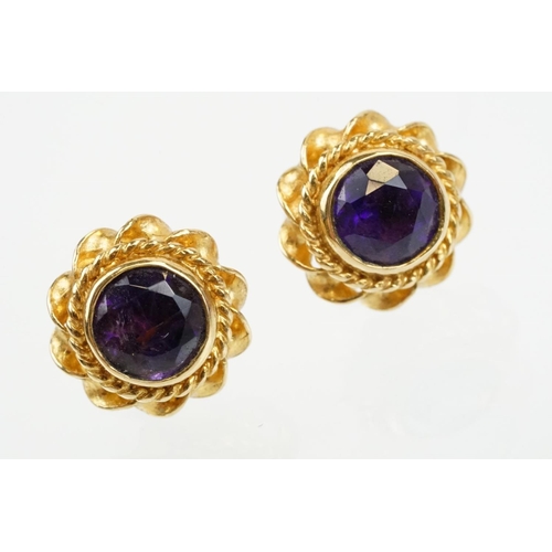 79 - Two pairs of 9ct gold stone set stud earrings to include a pair of ruby and diamond cluster earrings... 