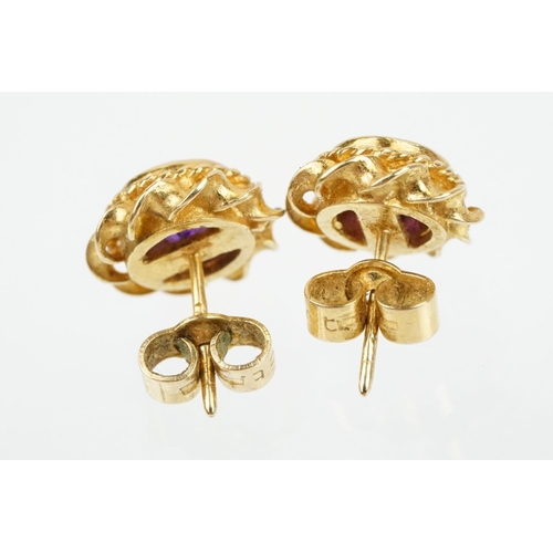 79 - Two pairs of 9ct gold stone set stud earrings to include a pair of ruby and diamond cluster earrings... 