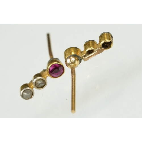 82 - Two pairs of gold earrings to include a pair of ruby and diamond three stone stud earrings (stud ear... 