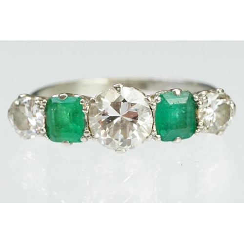 9 - Diamond and emerald five stone ring being set with a round cut diamond to the centre flanked by two ... 