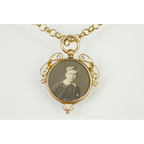 91 - Early 20th Century Edwardian photo locket having a round glazed photo panel having scrolled details ... 